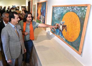 Chairman Senate, Syed Yousaf Raza Gilani keenly viewing art work after inaugurate the art exhibition "Sufism & Culture" by Roomi & Aiman at PNCA.