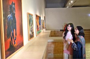 Chairman Senate, Syed Yousaf Raza Gilani keenly viewing art work after inaugurate the art exhibition "Sufism & Culture" by Roomi & Aiman at PNCA.