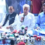 Defence Minister Khawaja Muhammad Asif talks to media persons at Shahabpura