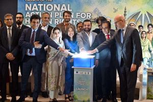 Minister of State for Law and Justice, Barrister Aqeel Malik, presses the button to formally launch the National Action Plan for Human Rights (NAP-HR) 2026 during a ceremony in the federal capital