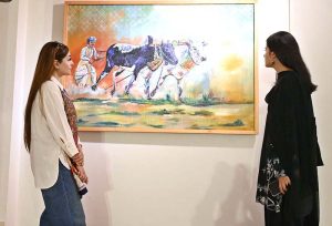 Chairman Senate, Syed Yousaf Raza Gilani keenly viewing art work after inaugurate the art exhibition "Sufism & Culture" by Roomi & Aiman at PNCA.