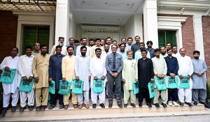 District Public Prosecutor Malik Amir Shahzad poses for a group photograph with newly promoted Class IV employees during a ceremony held in their honour at the District Public Prosecutor Office