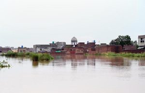 Residential area and buildings remain partially submerged after heavy monsoon rains caused the water level of the Ravi River to rise in Rana Town on the outskirts of the provincial capital.