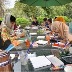 Participants engage in a painting workshop organized by Art Fusion by Mishal in collaboration with Chaaye Khana, Park Road