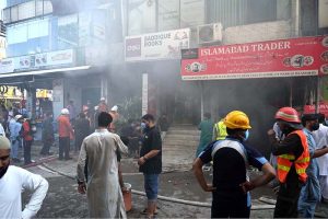 Firefighters coping to control fire erupted in the basement of a shopping mall in Karachi Company G-9 Markaz.