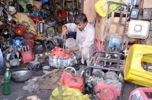 A mechanic assemble power generators to meet rising demand amid electricity shortages during the hot weather