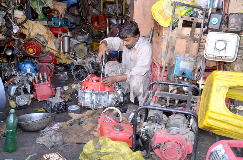 A mechanic assemble power generators to meet rising demand amid electricity shortages during the hot weather