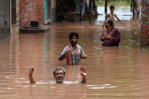 Residential area and buildings remain partially submerged after heavy monsoon rains caused the water level of the Ravi River to rise in Rana Town on the outskirts of the provincial capital.