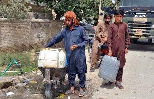 Residents of Sabzal Road in the provincial capital are transporting gallons filled with drinking water to their homes on handcarts.
