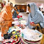 Participants visit the stalls on displayed at the ‘Concluding Ceremony-Empowering Women and Girls (EWG) project’ at a local hotel