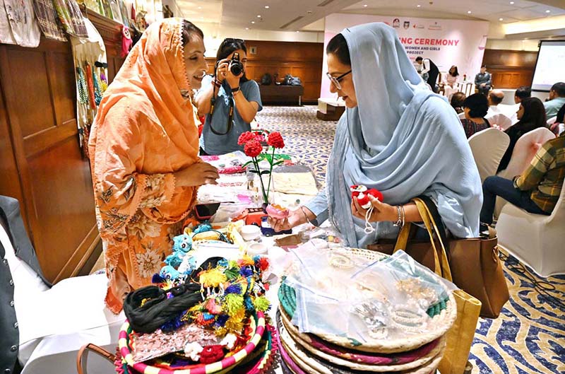 Participants visit the stalls on displayed at the ‘Concluding Ceremony-Empowering Women and Girls (EWG) project’ at a local hotel