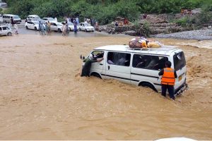 Flash floodwaters inundate roads and surrounding areas after heavy monsoon rains lashed Landi Kotal.