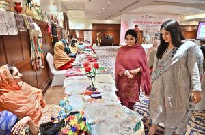 Participants visit the stalls on displayed at the ‘Concluding Ceremony-Empowering Women and Girls (EWG) project’ at a local hotel