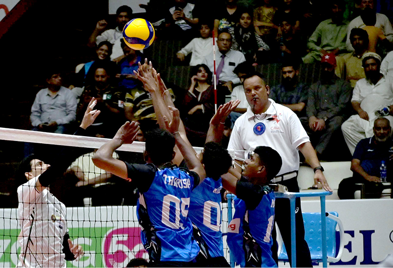 Pakistan and Sri Lanka players battle at the net during the semifinal of the CAVA Men's Volleyball Championship 2026 at Liaquat Gymnasium, Pakistan Sports Complex, players attacking prowess and solid defensive skills in a fiercely contested match