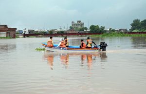 Volunteers distribute cooked meals to flood-affected families in Rana Town following heavy monsoon rains that raised the water level of the Ravi River.