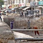 Labourers constructing a sewerage line in Shadman Town as authorities accelerate development work ahead of the expected monsoon rains