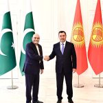 President Asif Ali Zardari and President Sadyr Zhaparov greeting each other with a warm handshake during an official engagement