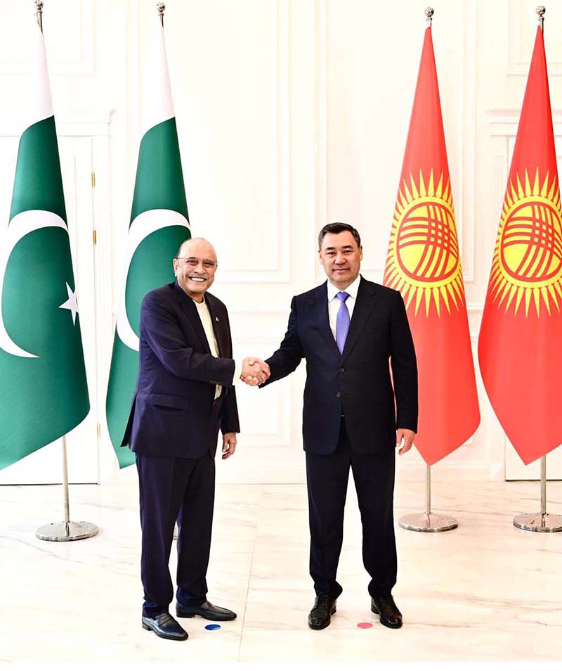 President Asif Ali Zardari and President Sadyr Zhaparov greeting each other with a warm handshake during an official engagement