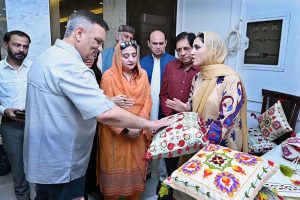 Vice chancellor Govt college woman University Sialkot Professor Dr, Shazia Bashir & President SCCI Syed Ehtesham Mazhar Gilani are viewing on display items during the exhibition of Art and Design at SCCI