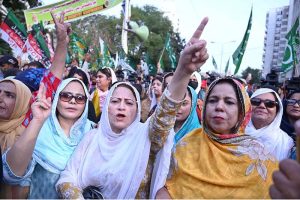 Members of the All Parties Hurriyat Conference J&K and various political parties chant slogans during a rally marking the martyrdom anniversary of Kashmiri freedom leader Burhan Wani