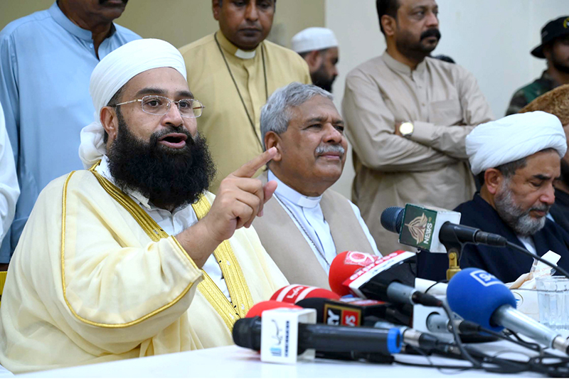 Chairman of the Pakistan Ulema Council, Maulana Tahir Ashrafi, addresses a press conference alongside religious scholars and officials at St. John Cathedral Church