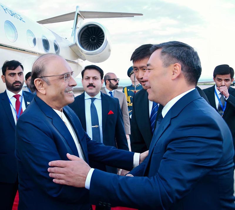 President Asif Ali Zardari being received by President of the Kyrgyz Republic Sadyr Japarov upon his arrival at Issyk-Kul International Airport