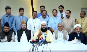 Chairman of the Pakistan Ulema Council, Maulana Tahir Ashrafi, addresses a press conference alongside religious scholars and officials at St. John Cathedral Church