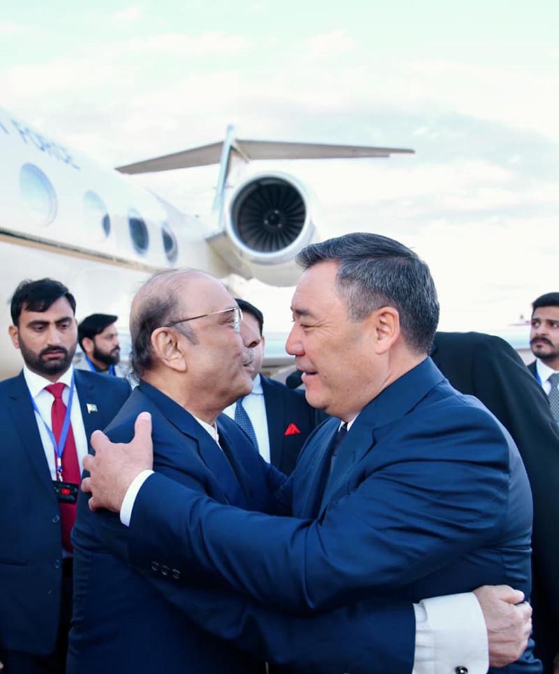 President Asif Ali Zardari being received by President of the Kyrgyz Republic Sadyr Japarov upon his arrival at Issyk-Kul International Airport