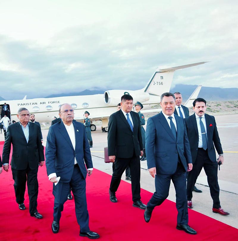 President Asif Ali Zardari being received by President of the Kyrgyz Republic Sadyr Japarov upon his arrival at Issyk-Kul International Airport