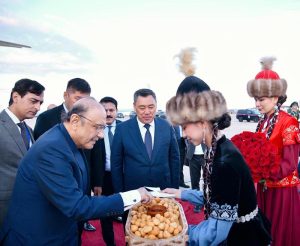 President of Pakistan Asif Ali Zardari is presented with traditional Kyrgyz boorsok and honey as part of the official welcome ceremony upon his arrival at Issyk-Kul International Airport, in the presence of President of the Kyrgyz Republic Sadyr Japarov