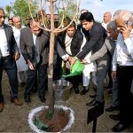 Chairman CDA and Chief Commissioner ICT, Lt. (Retd.) Sohail Ashraf, plants and waters a sapling during the Tree Plantation Drive organized by the Clean & Green Islamabad Movement at Parade Ground