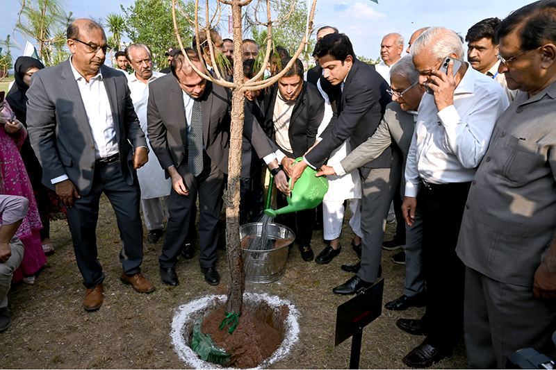 Chairman CDA and Chief Commissioner ICT, Lt. (Retd.) Sohail Ashraf, plants and waters a sapling during the Tree Plantation Drive organized by the Clean & Green Islamabad Movement at Parade Ground