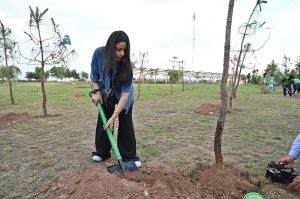Students plant a sapling during the Tree Plantation Drive organized by the Clean & Green Islamabad Movement at Parade Ground in the federal capital