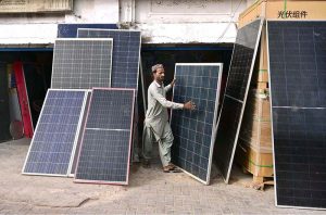 A vendor displaying solar penal to attract the customer at station road