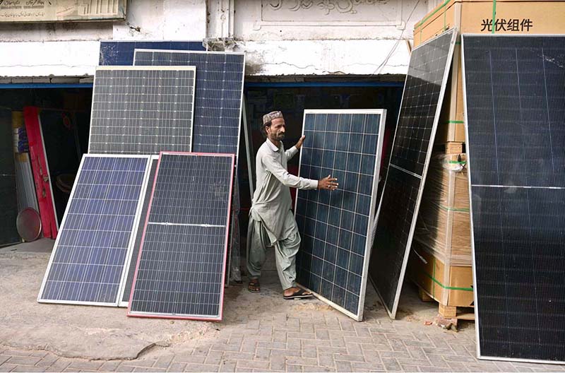 A vendor displaying solar penal to attract the customer at station road