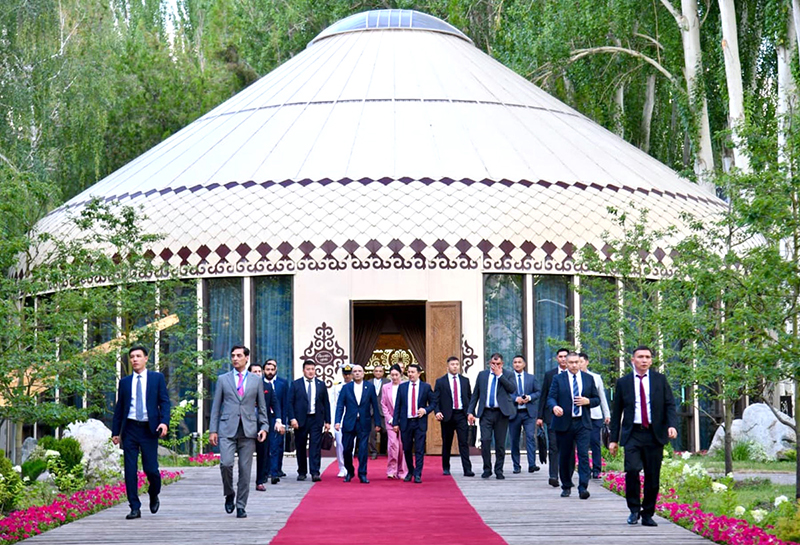 President Asif Ali Zardari and Marlen Mamataliyev, Speaker of the Jogorku Kenesh of the Kyrgyz Republic, walk to the Golden Yurt following their meeting