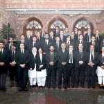Advocate General Punjab Muhammad Amjad Pervez poses for a group photograph with law officers of the Advocate General's Office during his farewell meeting in the provincial capital