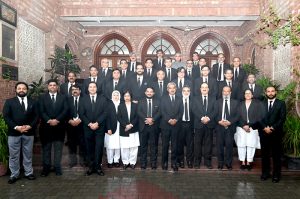 Advocate General Punjab Muhammad Amjad Pervez poses for a group photograph with law officers of the Advocate General's Office during his farewell meeting in the provincial capital