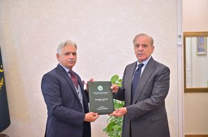 Chairman National Rahmatul-lil-Alameen Wa Khatam an-Nabiyyin Authority, Khursheed Ahmed Nadeem presenting the annual report of the organization to Prime Minister Muhammad Shehbaz Sharif.
