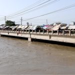 A large number of handcarts parked under makeshift shades on the bridge over the Rice Canal near the Old Bus Stand obstruct the flow of traffic, drawing attention to the need for corrective measures by the concerned authorities