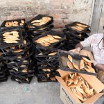 A worker busy in work at a local bakery near Rahmat Pur