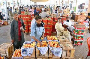 Vendors are displaying apples to attract the customers at Fruit Market.
