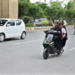 The morning traffic is already beginning to swell when a woman pulls down her helmet, places both hands firmly on the handlebar of her scooty and joins the moving stream of vehicles. There is nothing unusual about a vehicle entering traffic, yet the scene carries a significance that goes beyond the road. A woman who once waited for someone else to drive her is now choosing her own route, timing her own journey and deciding when she will return. (Match the photo with APP feature slugged “From passenger seat to handlebar: women take control of their journeys” already been released)