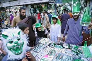 A family is busy purchasing Independence Day-related items at Paper Market in connection with the upcoming Independence Day celebrations.
