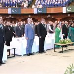 Chairman Senate, Syed Yousuf Raza Gilani, and distinguished guests standing in respect of the national anthem at the Azadi Cultural Show at Jinnah Convention Centre