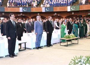 Chairman Senate, Syed Yousuf Raza Gilani, and distinguished guests standing in respect of the national anthem at the Azadi Cultural Show at Jinnah Convention Centre
