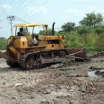 Work in progress as heavy machinery is used for the construction of a six-lane road along the east side of Islamabad Expressway, in the Federal Capital