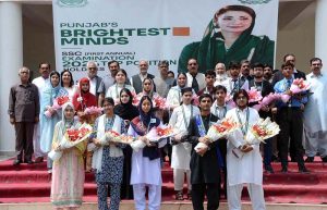 Chairman Board of Intermediate & Secondary Education (BISE) Faisalabad, Dr Rana Binyamin, presents a laptop to the overall first position holder of the Matriculation Examination 2026 during a prize distribution ceremony held at the BISE Auditorium.