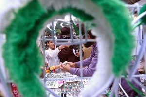 A family is busy purchasing Independence Day-related items at Paper Market in connection with the upcoming Independence Day celebrations.