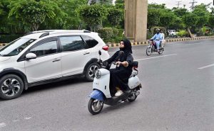 The morning traffic is already beginning to swell when a woman pulls down her helmet, places both hands firmly on the handlebar of her scooty and joins the moving stream of vehicles. There is nothing unusual about a vehicle entering traffic, yet the scene carries a significance that goes beyond the road. A woman who once waited for someone else to drive her is now choosing her own route, timing her own journey and deciding when she will return. (Match the photo with APP feature slugged “From passenger seat to handlebar: women take control of their journeys” already been released)